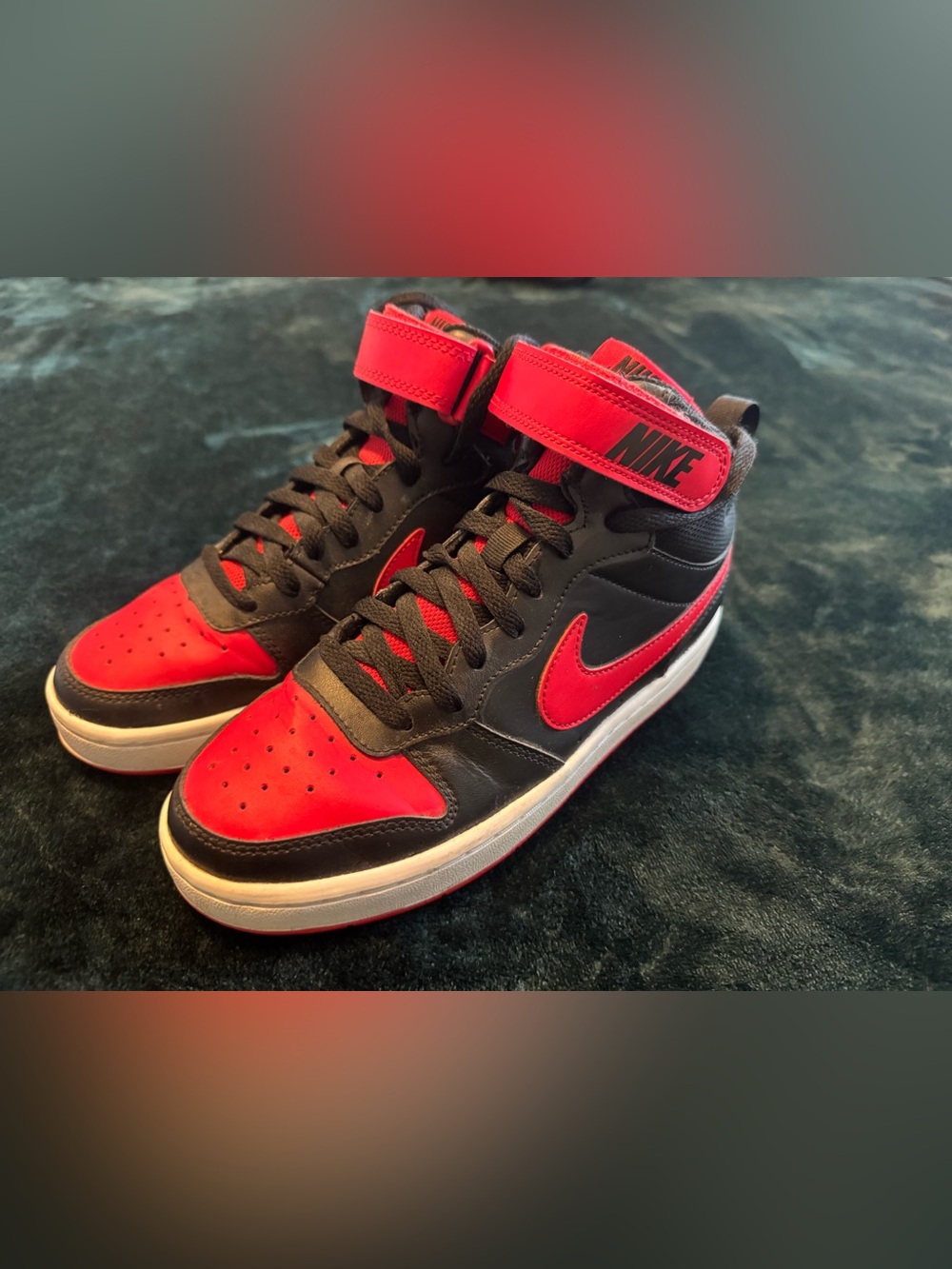Black and red Nike Jordans
